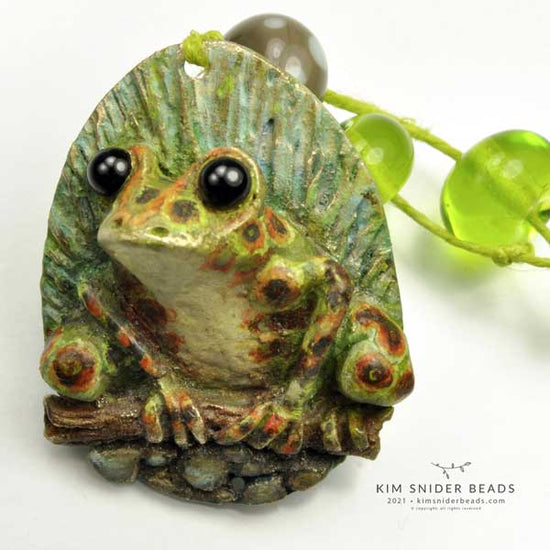 Frog pendant focal, 2021. This piece is a handcrafted, original artbead created by Kim Snider. All rights reserved on all artwork on this site.  