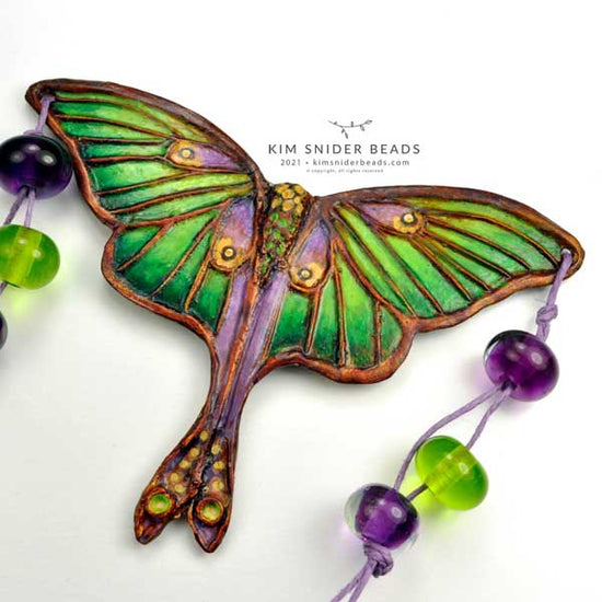 Luna moth pendant focal, bronze. This one-of-a-kind Kim Snider artbead was created in 2021.