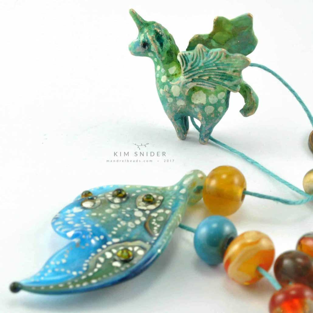 Unicorn pegasus artbead and silver embellished lampwork butterfly wing bead by Kim Snider. 